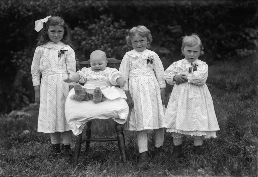 Photo identical quadruplets different outcomes raised together